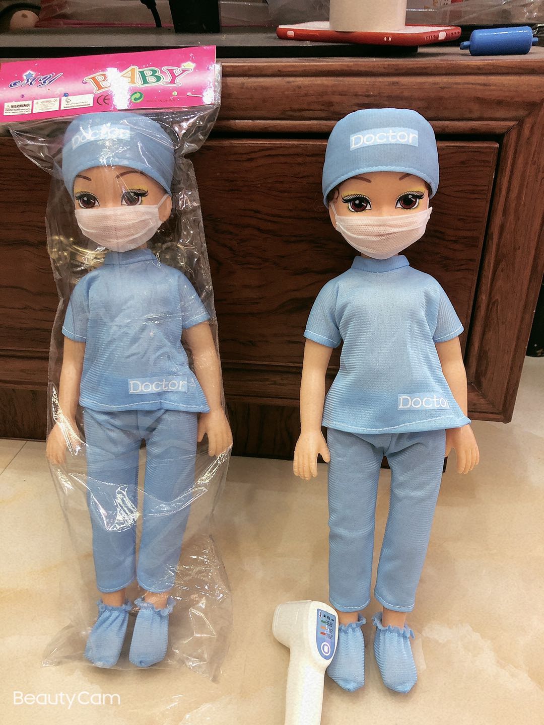 The nurse had a temperature gun thumbnail
