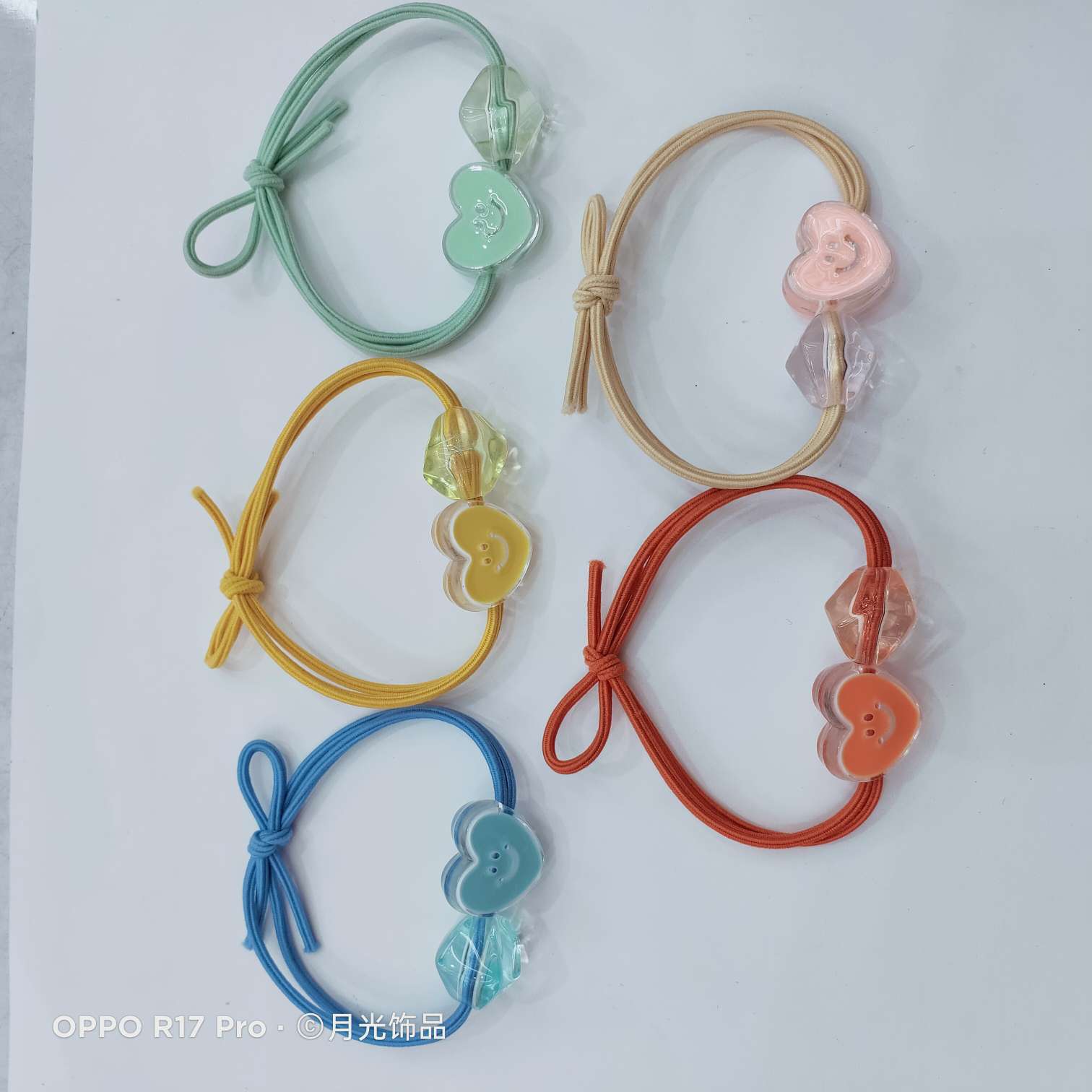 Korean trendy and fashionable macaron-colored smiling face, heart, transparent corner beads, knotted leather band, hair band and leather case Application Scenario