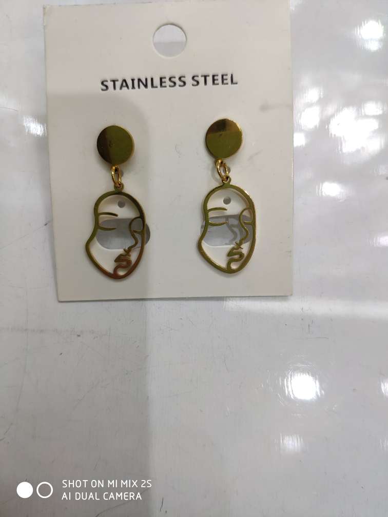 Stainless steel face hanging earrings.