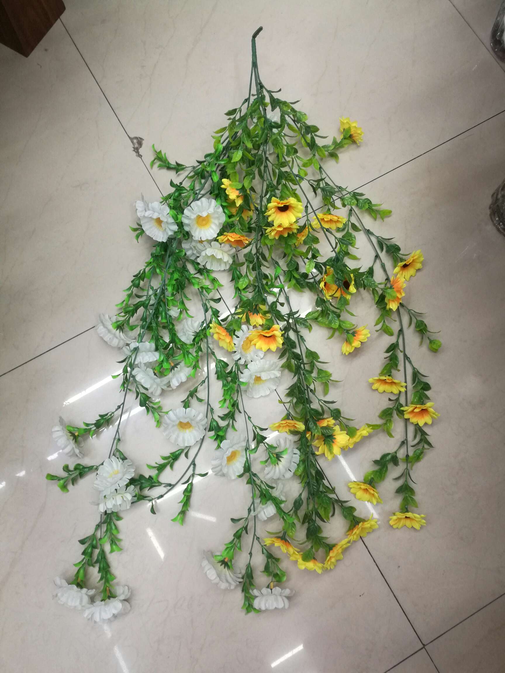 Small broken flowers hanging on the wall thumbnail