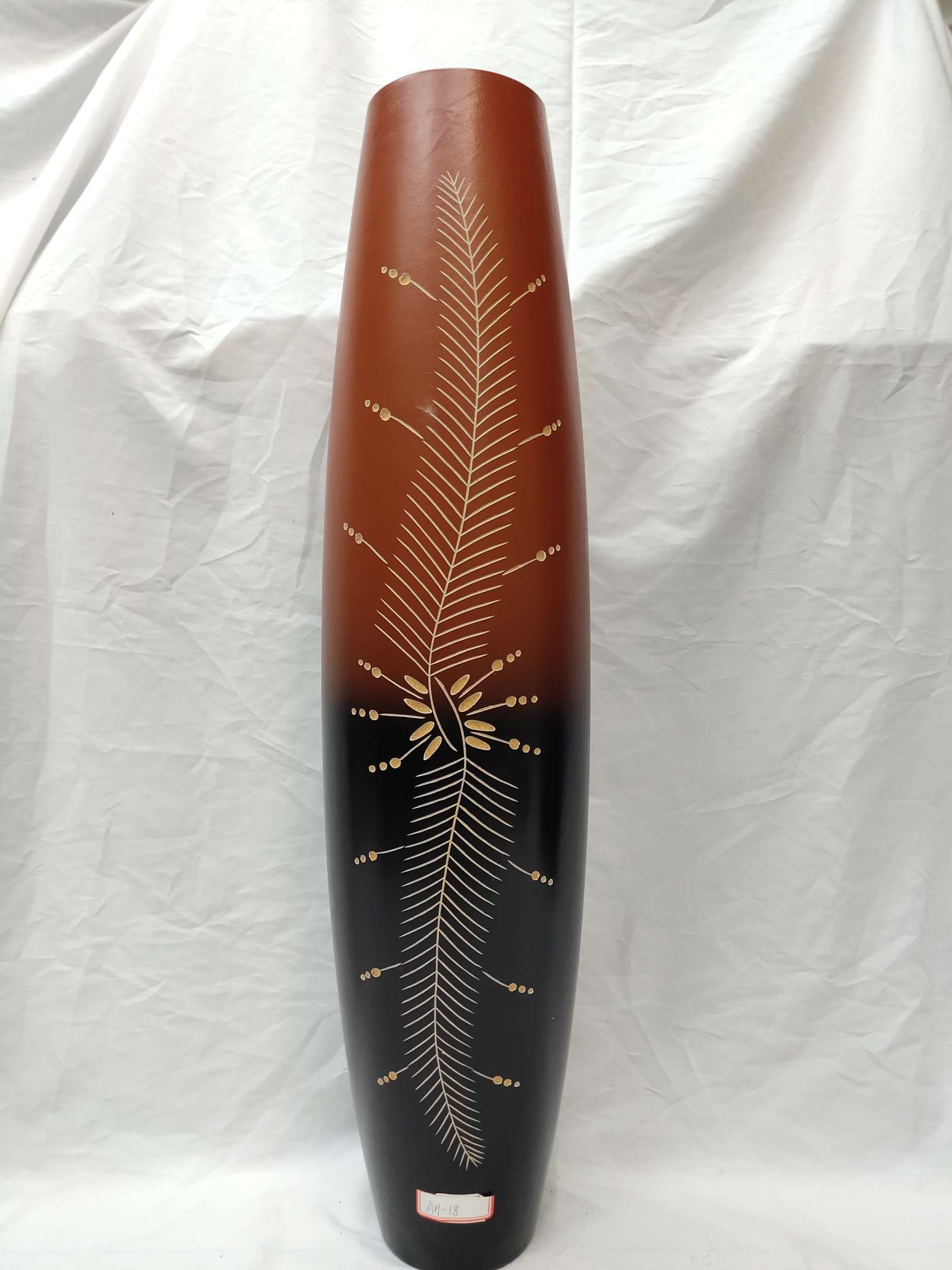 A large floor-standing vase hand-carved from density board