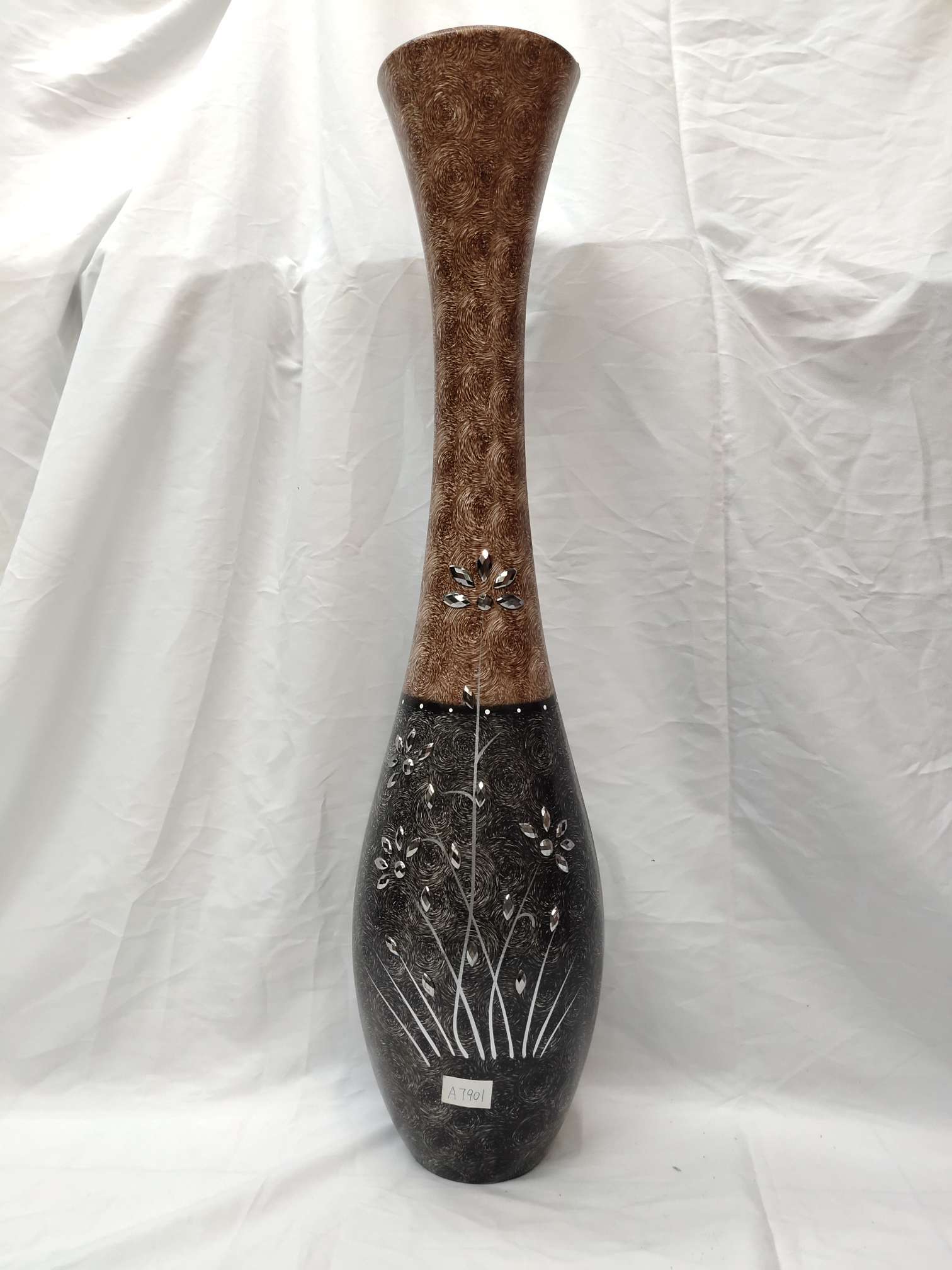A large floor-standing vase with a cinched waist