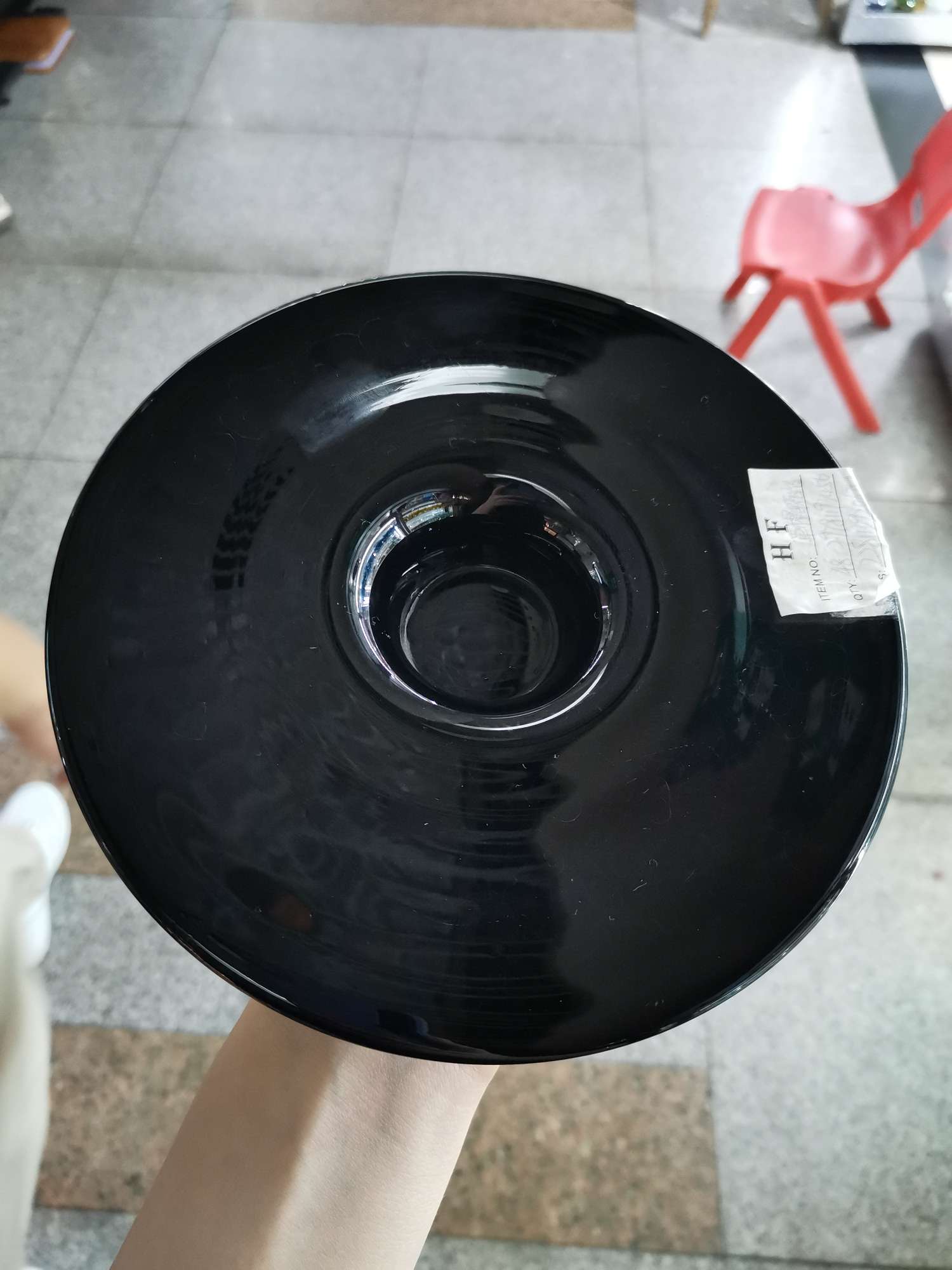 Black glass candlestick in the shape of a straw hat