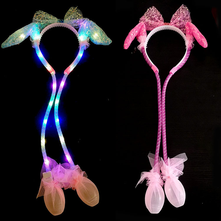 The New Year's heart-shaped hair band with luminous lights, the popular rabbit ears, will move and make sounds when pinched. The same style of sequined mesh new hair accessory undefined