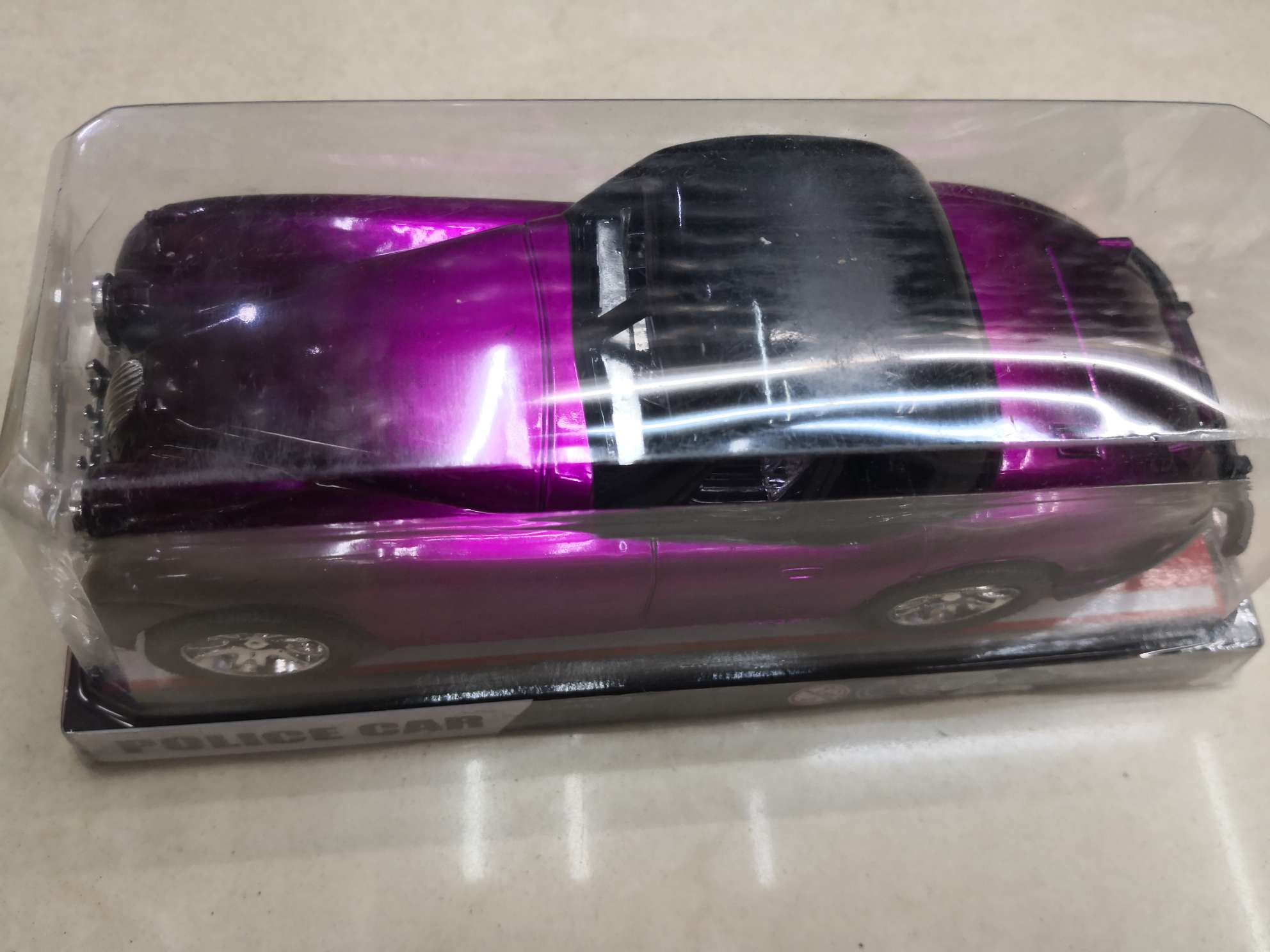 A pink blister children's toy jalopy