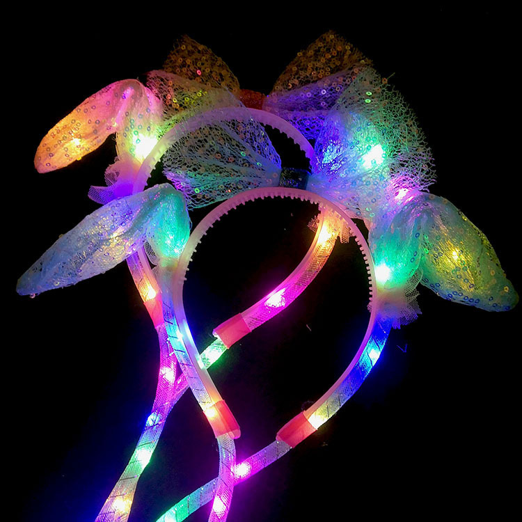 The New Year's heart-shaped hair band with luminous lights, the popular rabbit ears, will move and make sounds when pinched. The same style of sequined mesh new hair accessory undefined