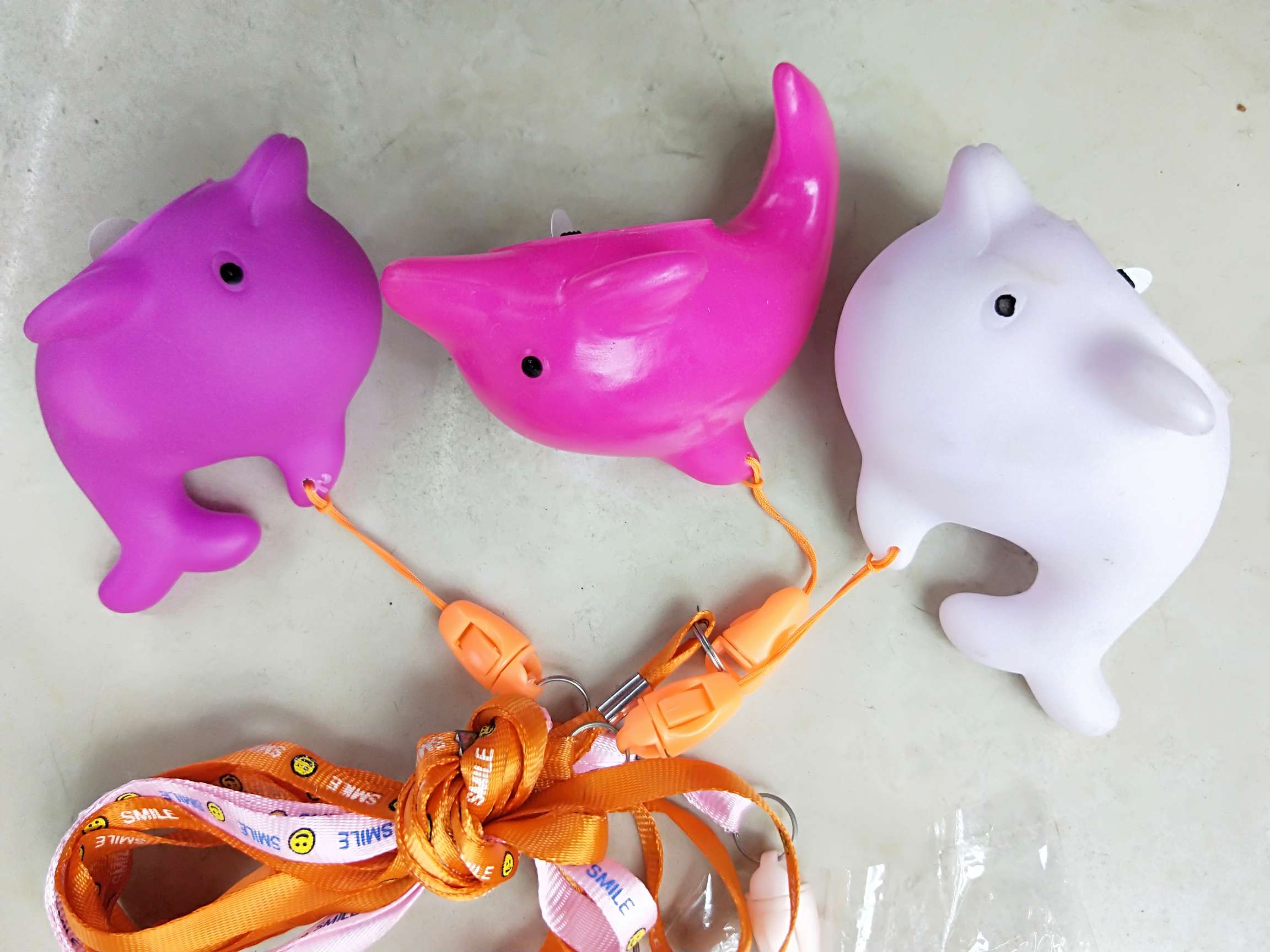 Enamelled hanging ropes illuminated dolphins