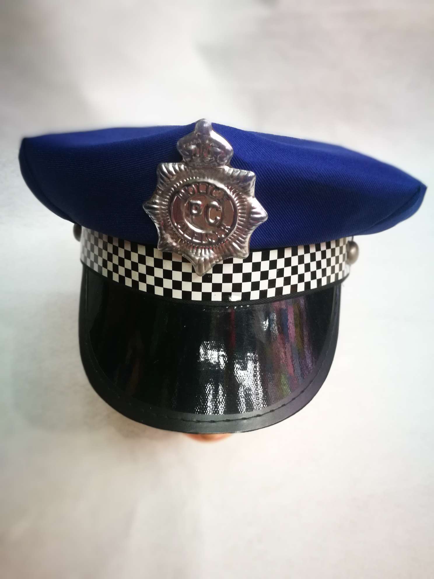 蓝色警察帽塑料徽，黑白格