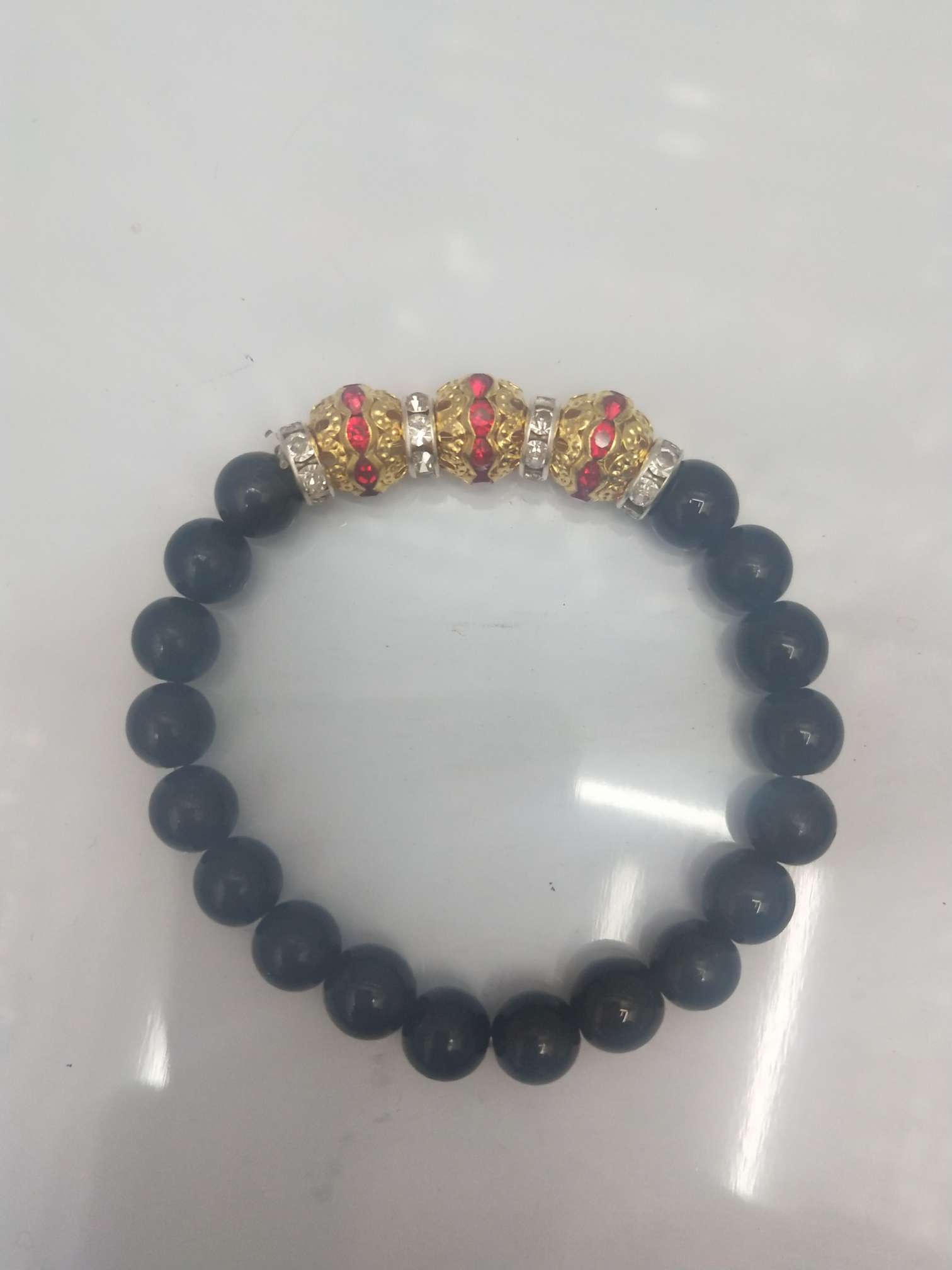 Three golden red diamond balls and black bead hand rings thumbnail