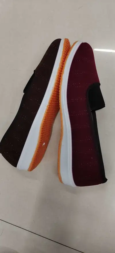 An Old Woman's Cloth Shoes With A Single Shoe