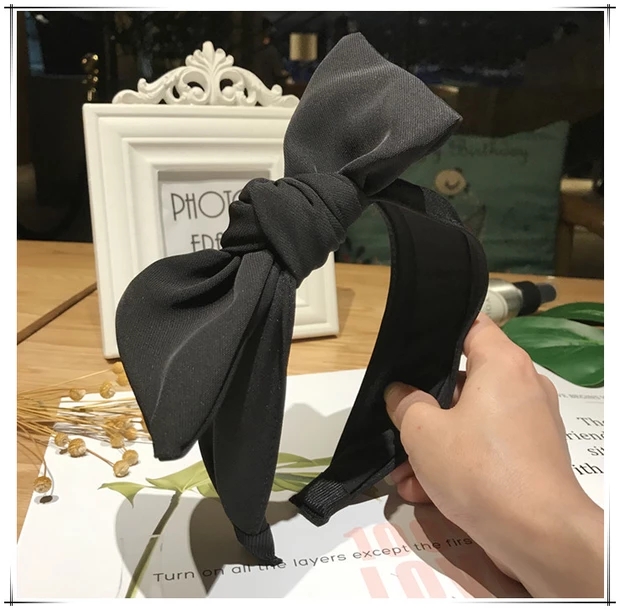The new Korean version of pure color temperament fashion oblique bow hair hoop thumbnail