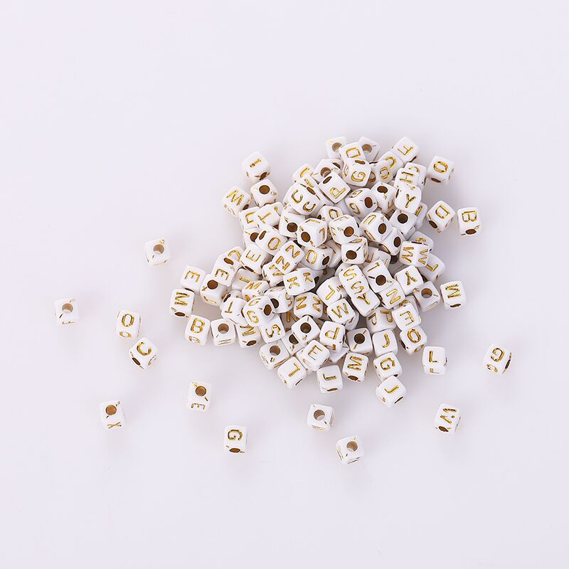 5mm letter beads with white background and gold characters