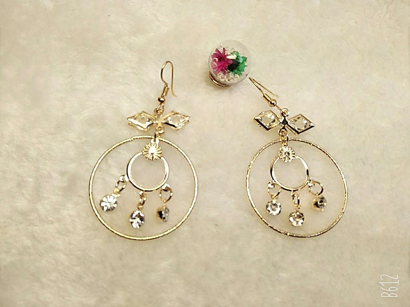 Sparkly earrings with big exaggerated rings thumbnail