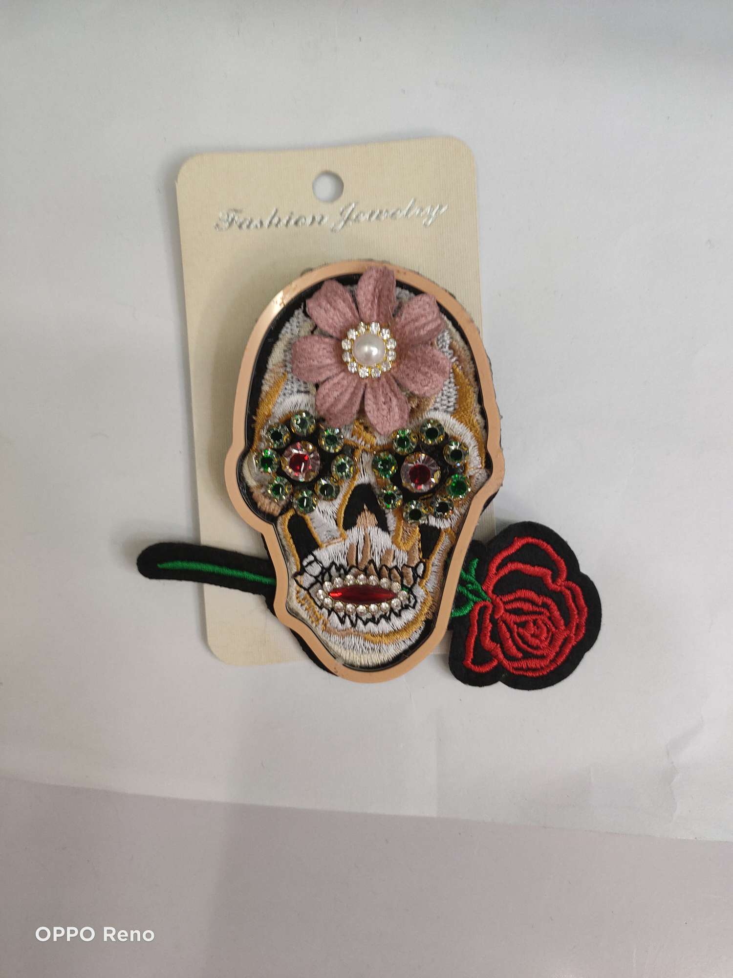 Rose head brooch