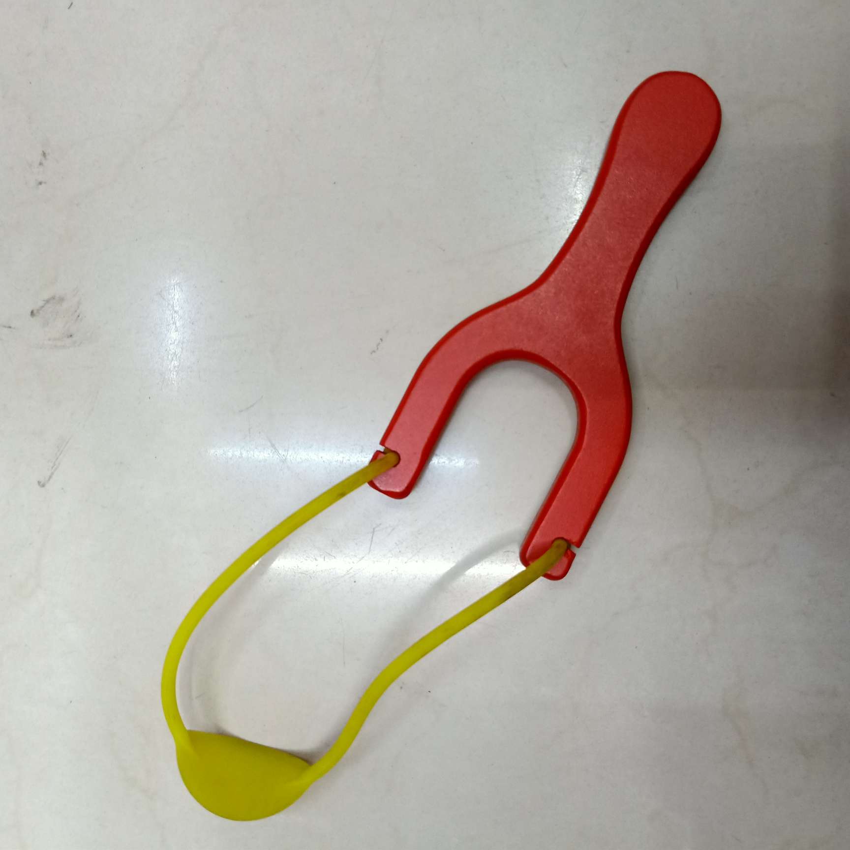 Red wooden slingshot details Picture