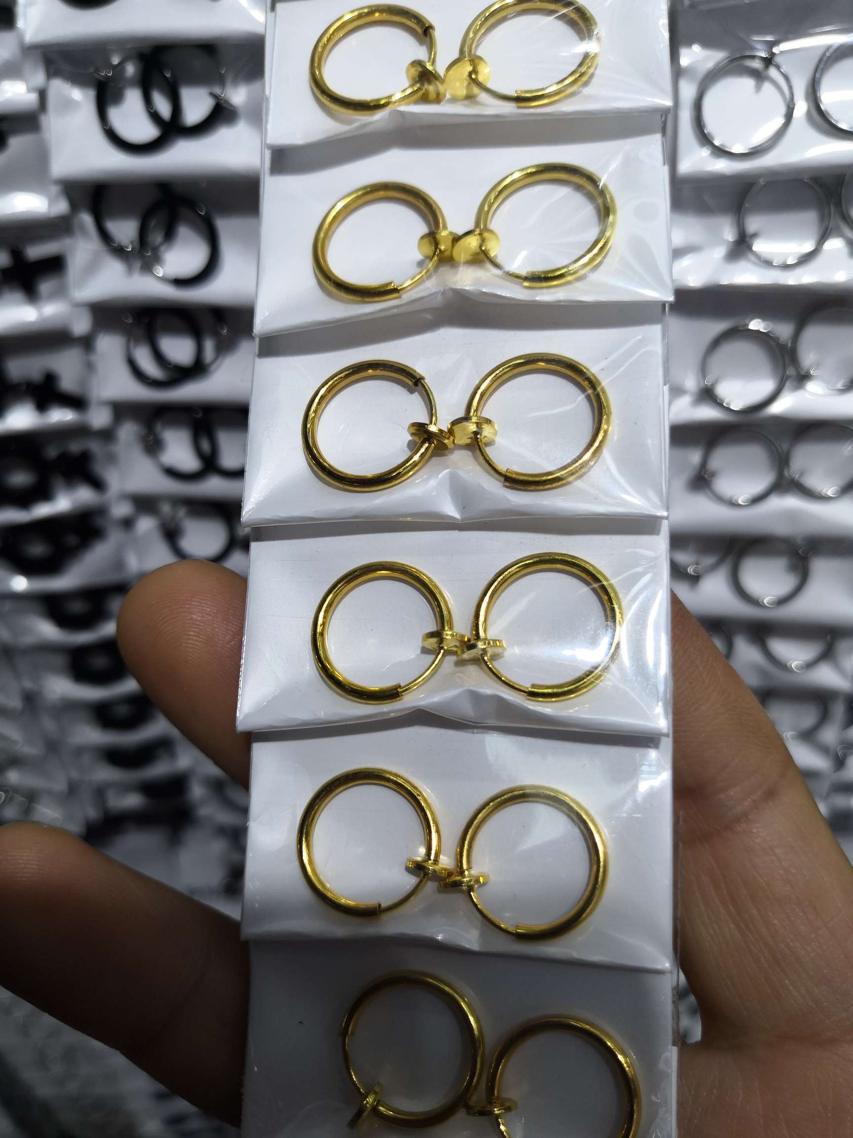 No ear piercings, golden ear clips