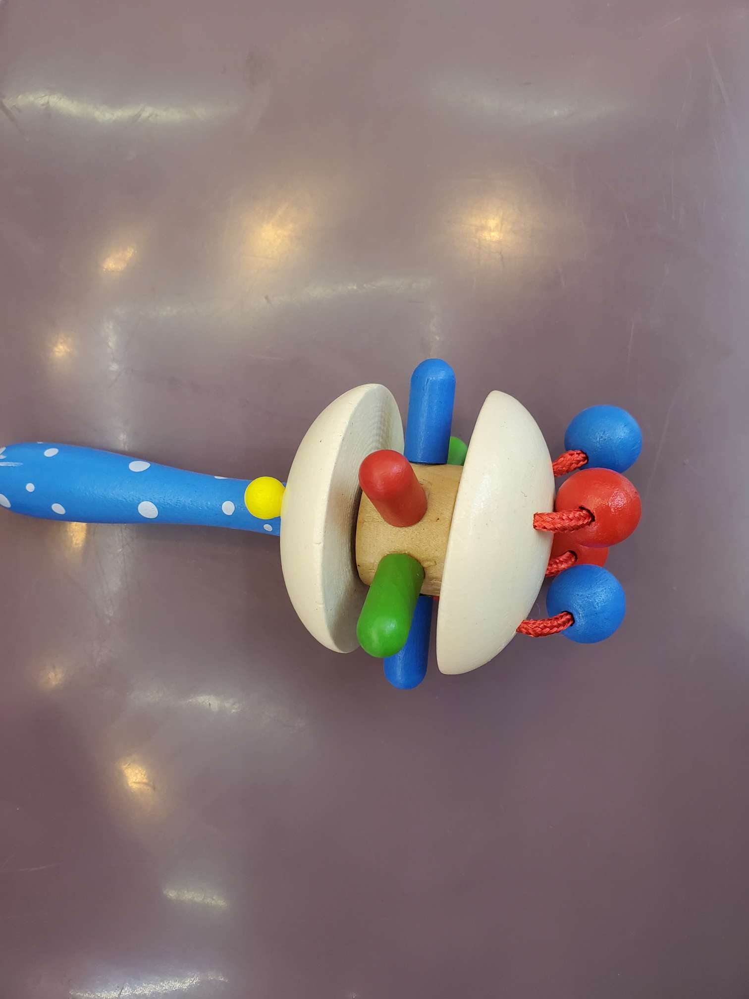 A wooden hand-cranked bell specially designed for babies Application Scenario