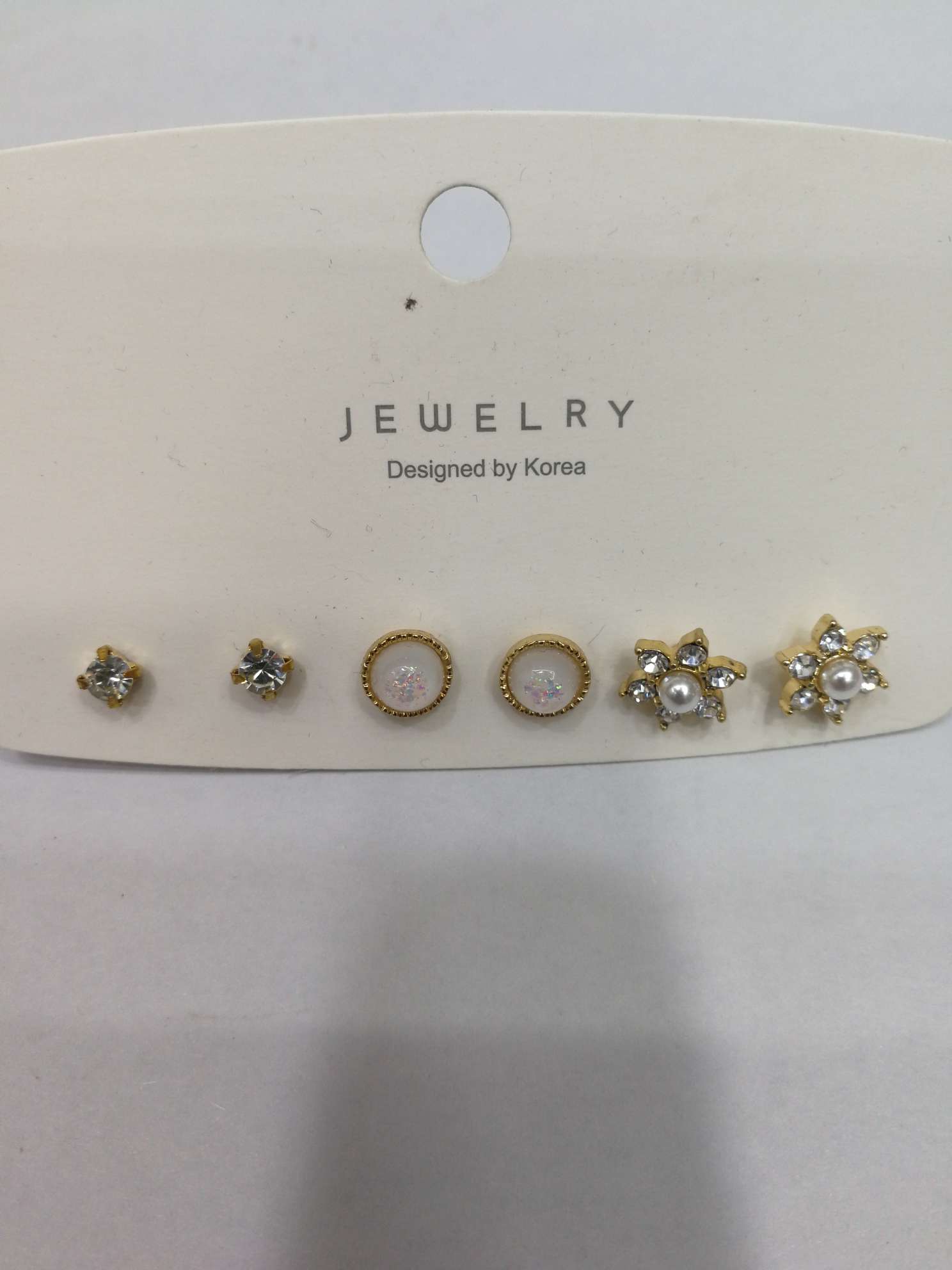 Three pairs of stud earrings