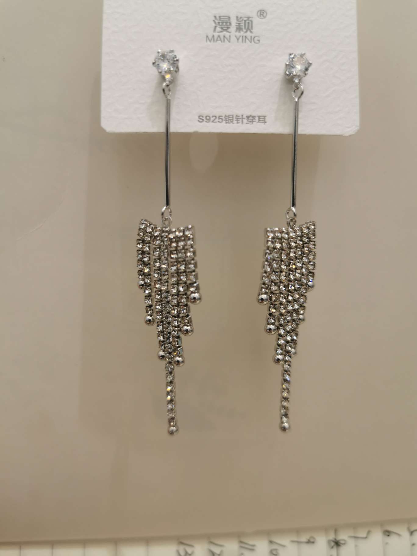 S925 silver needle long tassel earrings, shining with diamonds, exude a laid-back and elegant charm