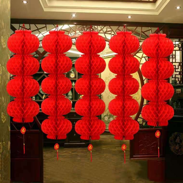 A string of big red lanterns, honeycomb red lanterns, plastic paper lanterns, festival celebration, wedding celebration, and shopping mall decoration lantern strings