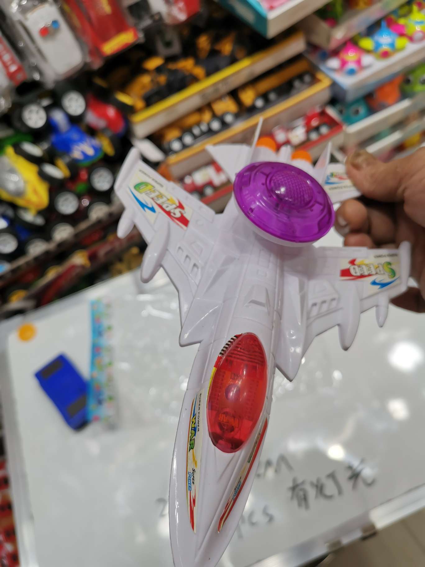 A lighted aircraft with a string details Picture