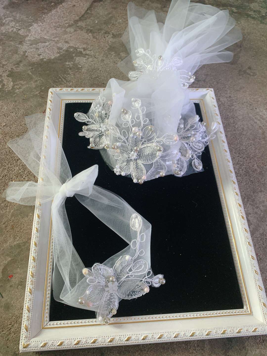 The veil set is embroidered in white thumbnail