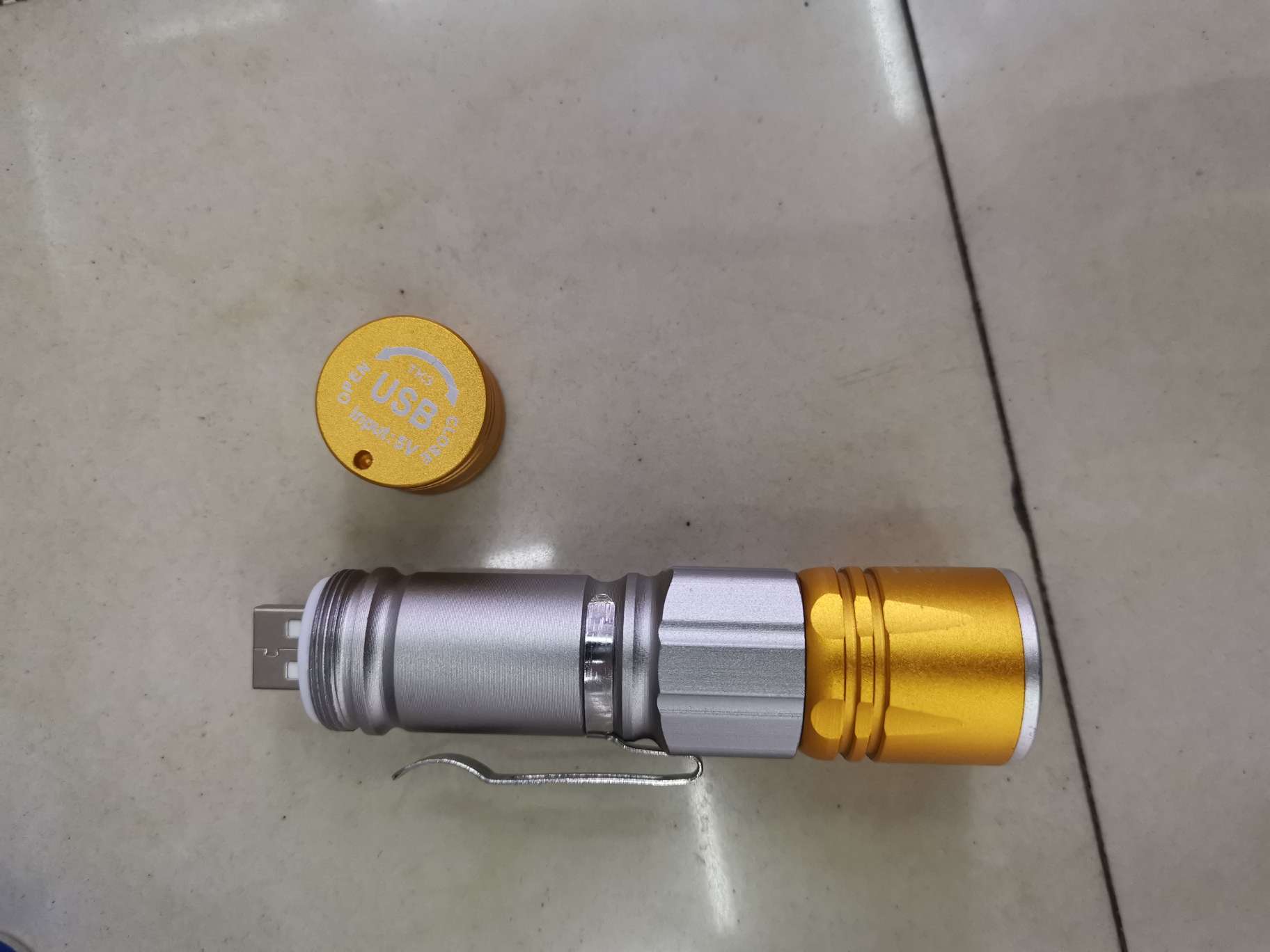 318USB rechargeable aluminum alloy focusing flashlight with multi-color mixing details Picture