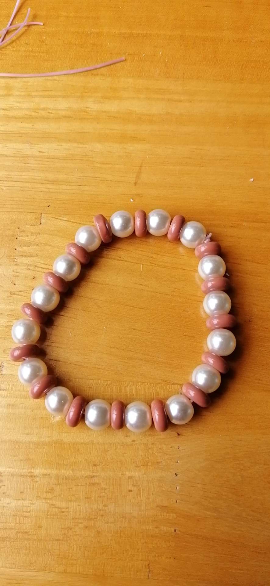 Pearls on a beaded bracelet