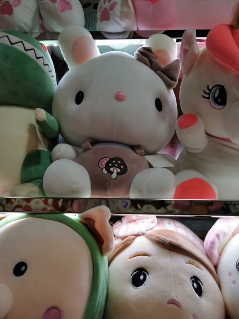 helllokey plush toy doll with a backpack