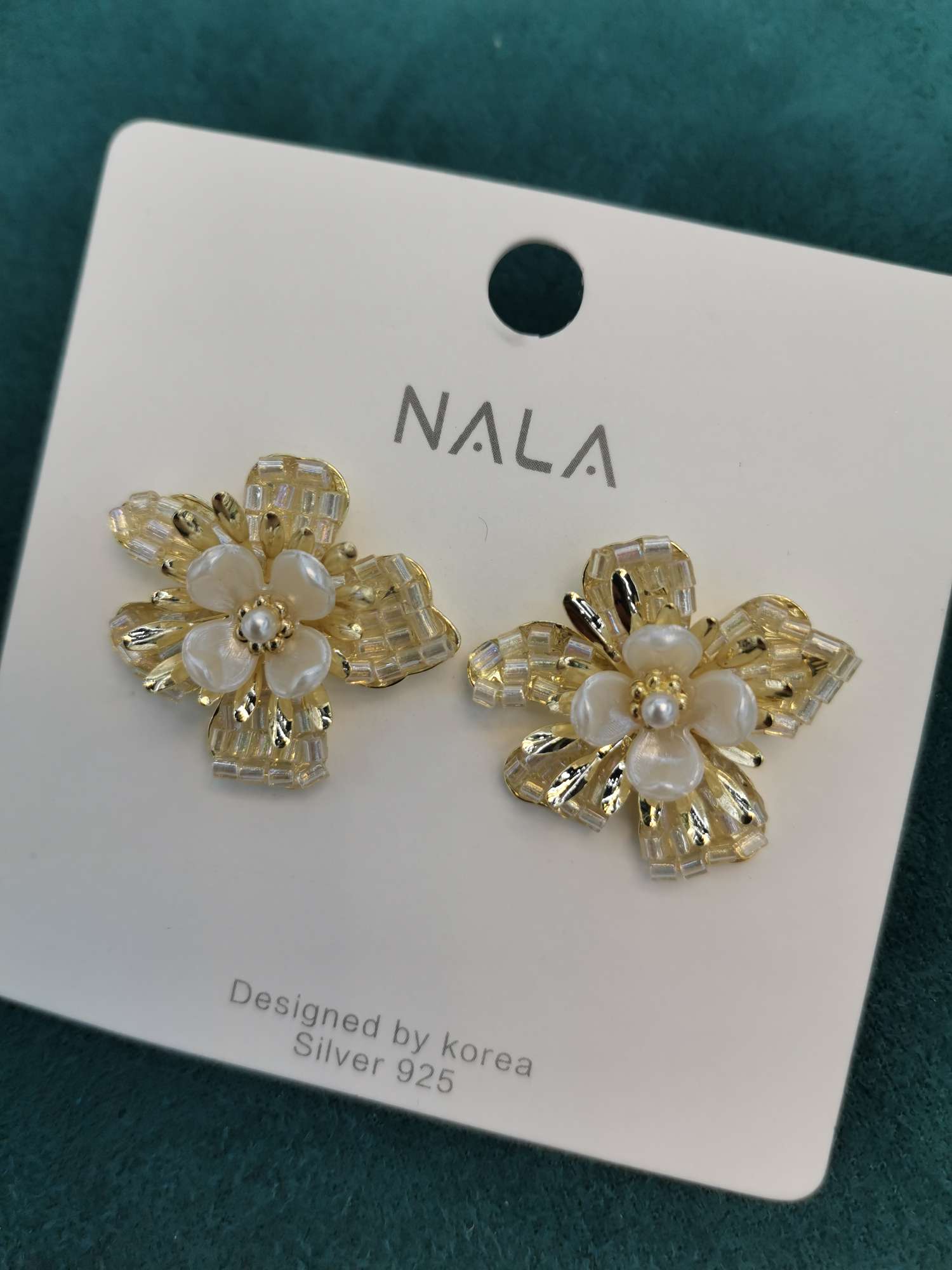 Delicate ear studs at Dongdaemun, South Korea thumbnail
