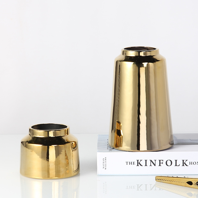 Nordic gilt vase with floral arrangement thumbnail