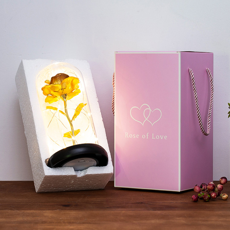 Gold foil rose with a glass cover ornament undefined