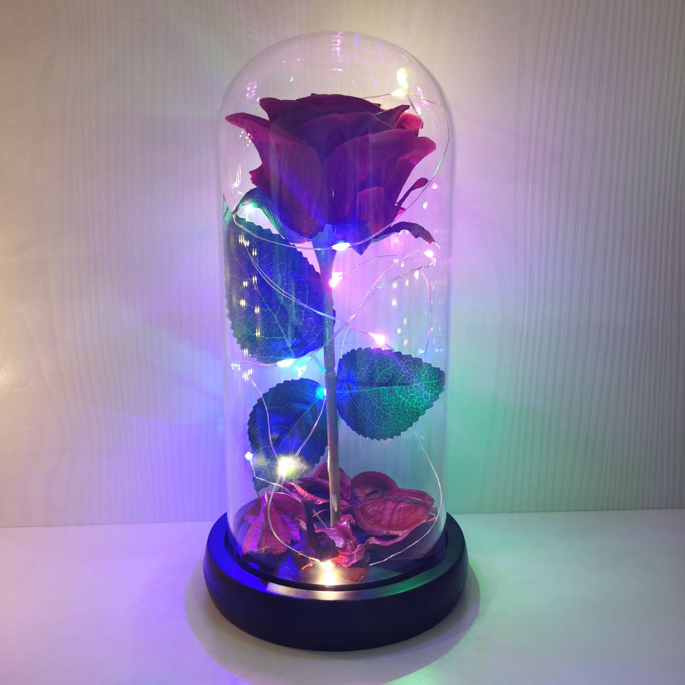 A silk flower ornament with a glass cover details Picture
