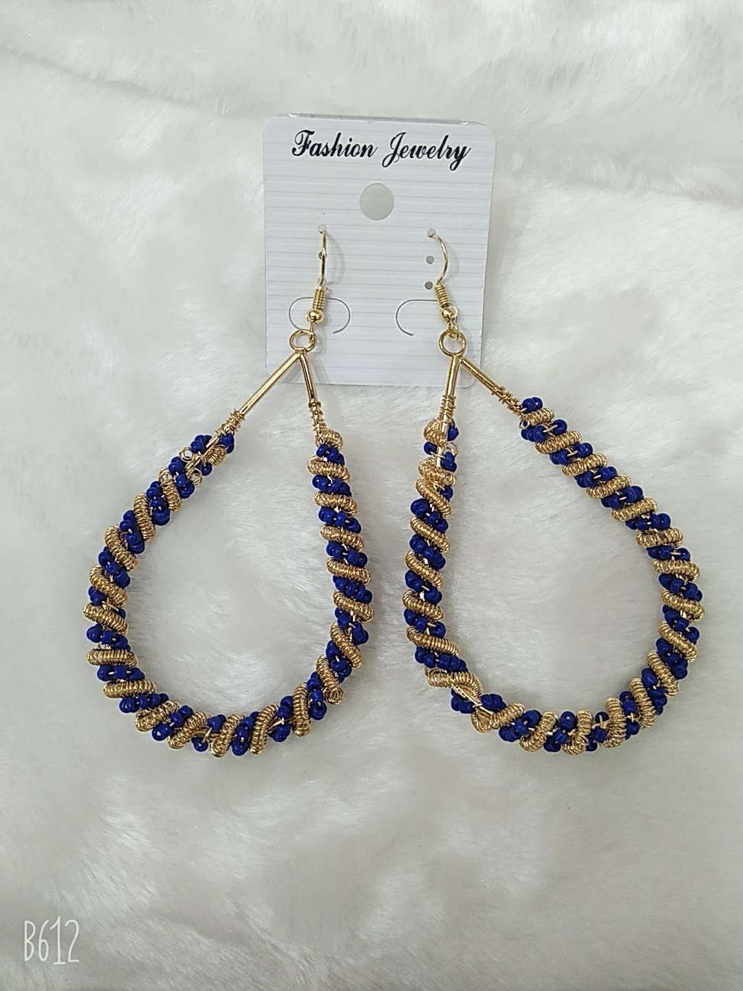 Glass rice beads surround drip pop earrings