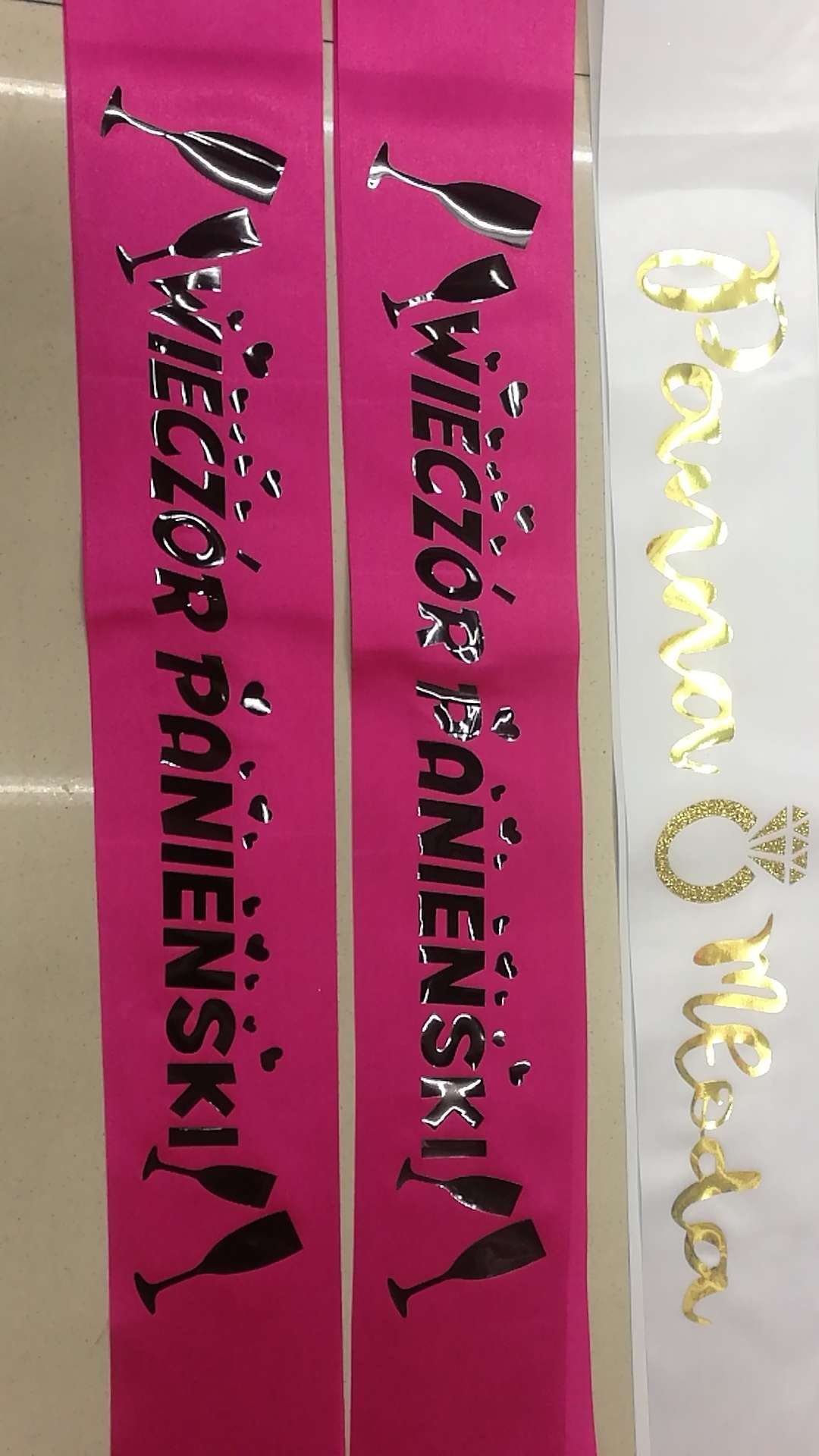 Specializing in the production of gold and silver embossed shoulder straps, etiquette straps, LOGO design for festivals, balls, parties, bridal parties, and bachelor parties undefined