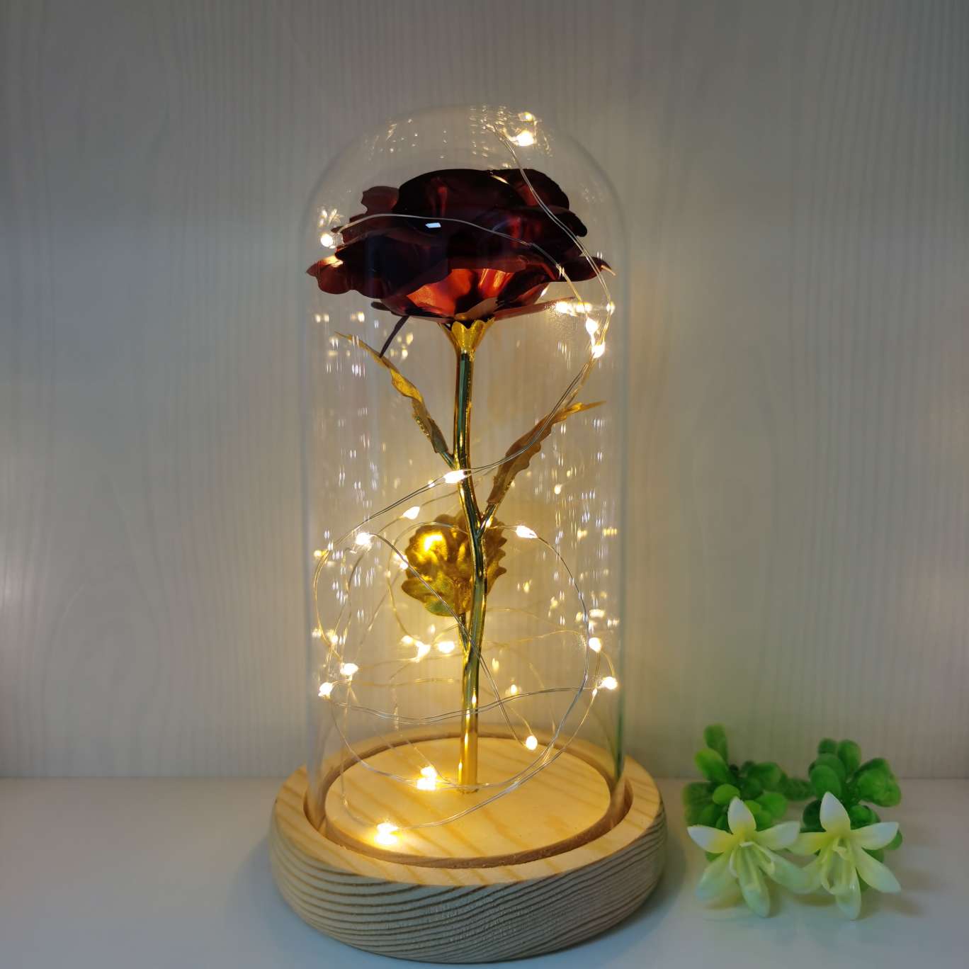 Gold foil rose with a glass cover ornament undefined
