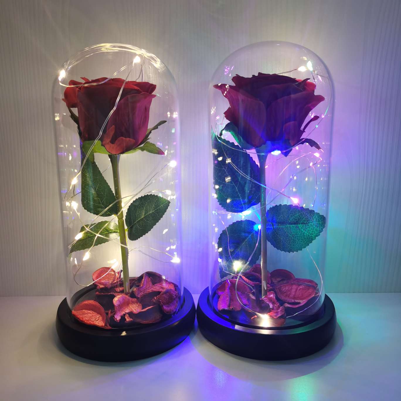 A silk flower ornament with a glass cover undefined