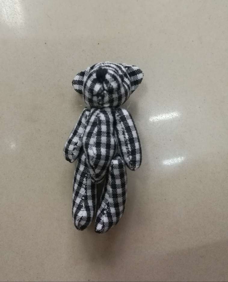 A 6-centimeter black and white bear