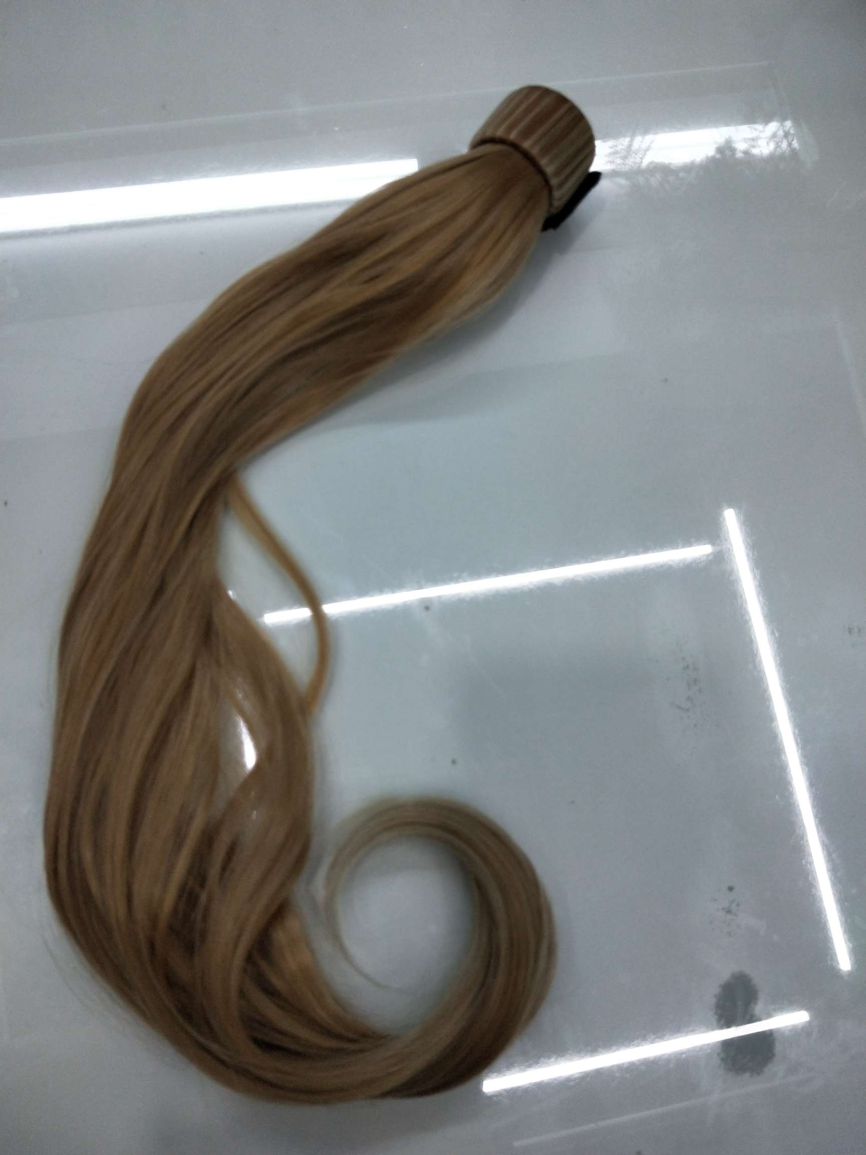 Woman with curly hair, large waves, high temperature silk ponytail wig
