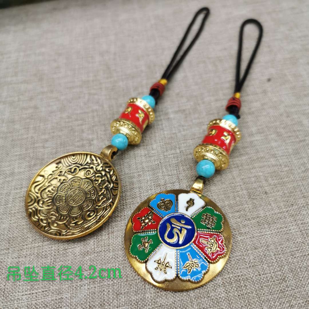 The prayer wheel is paired with a painted waist tag featuring the twelve Chinese zodiac signs and the nine palaces and Eight Trigrams