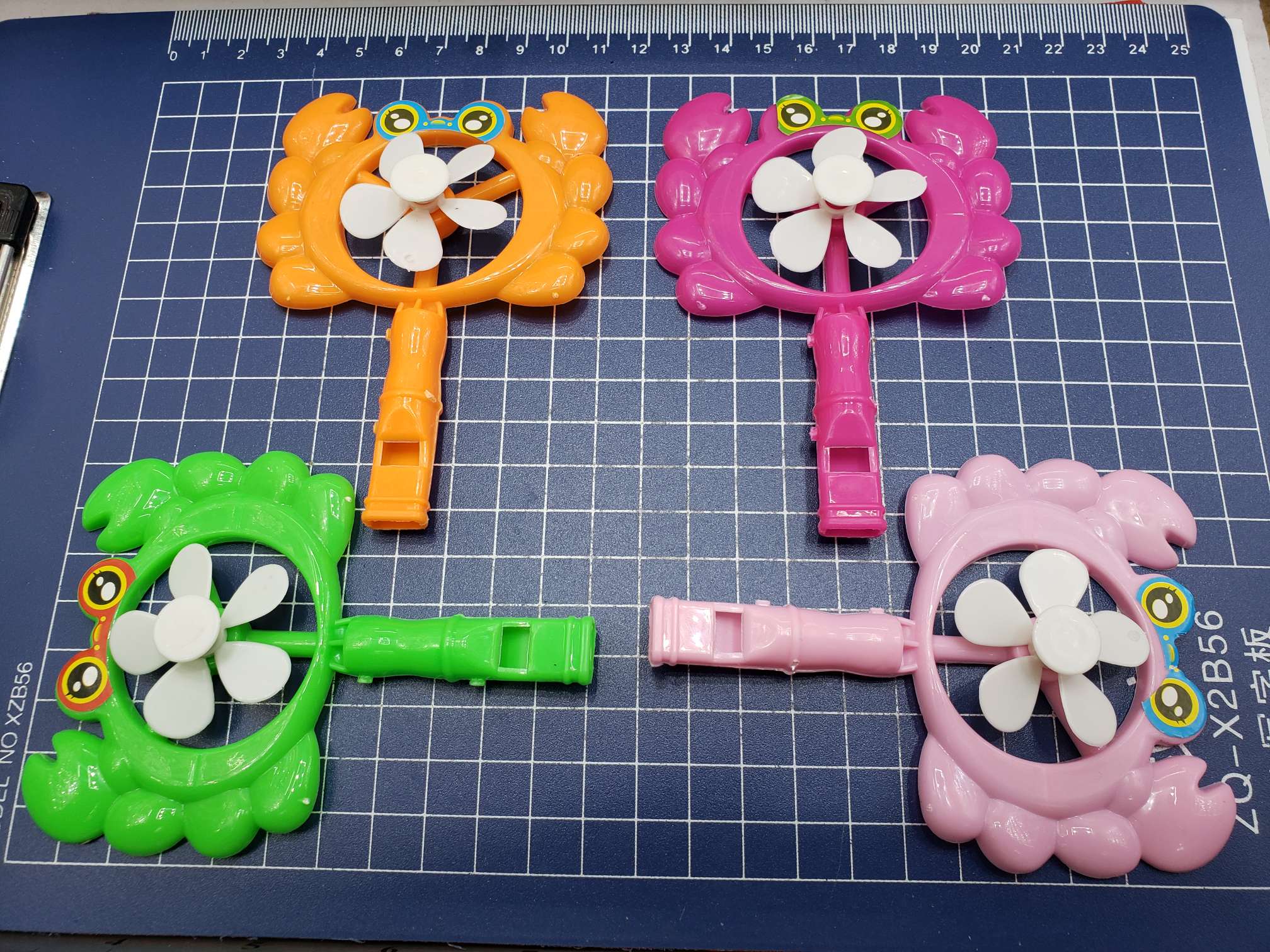 Plastic crab windmill turns thumbnail