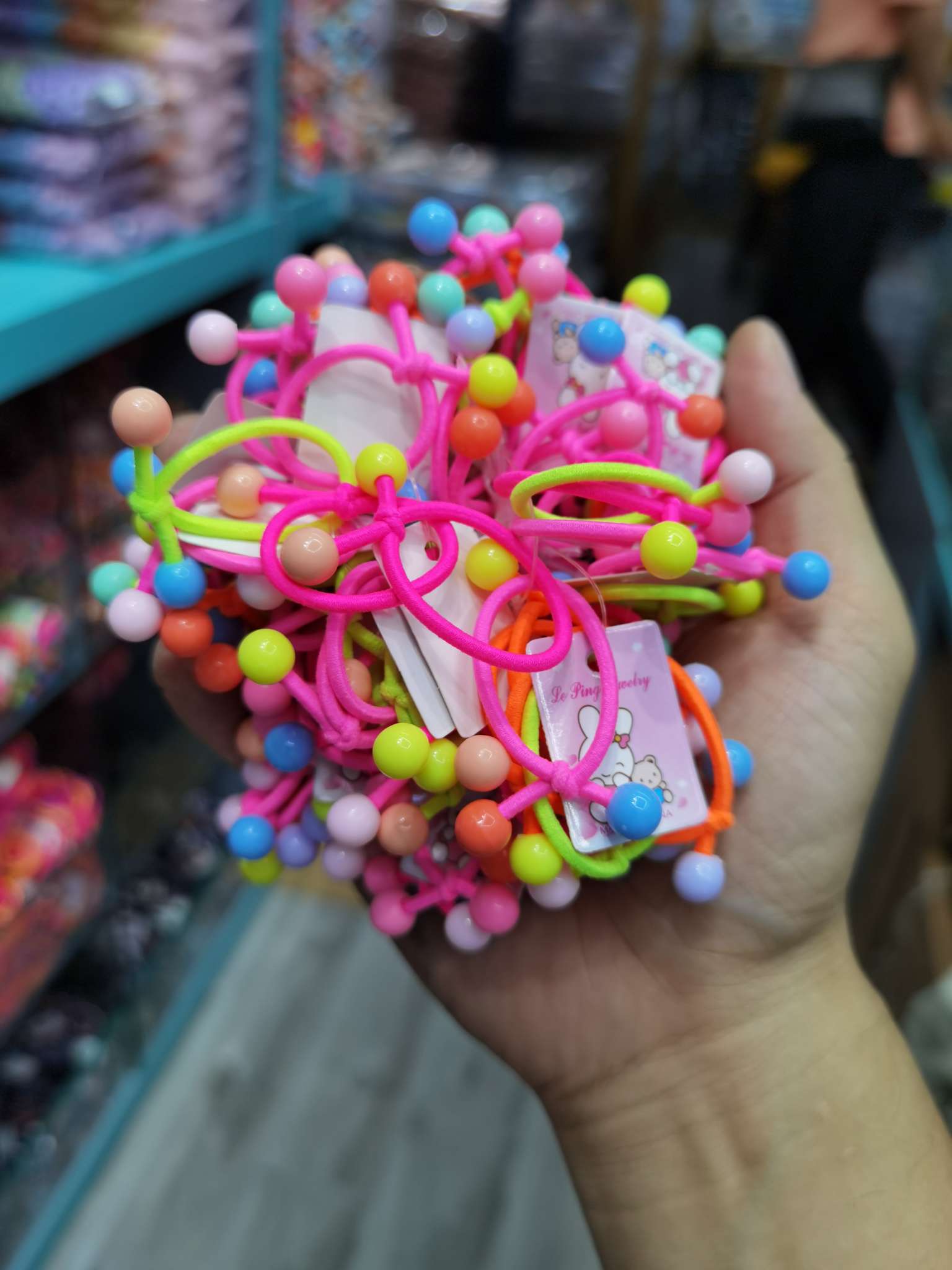 Genuino lefang derm band venta directa de fábrica niños nudo colorido cuentas redondas 100 tiras con etiqueta