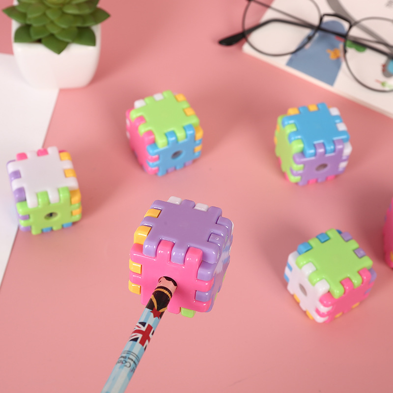 Creative cartoon plastic building block puzzles, children's pencil sharpeners, and small stationery gifts for students undefined