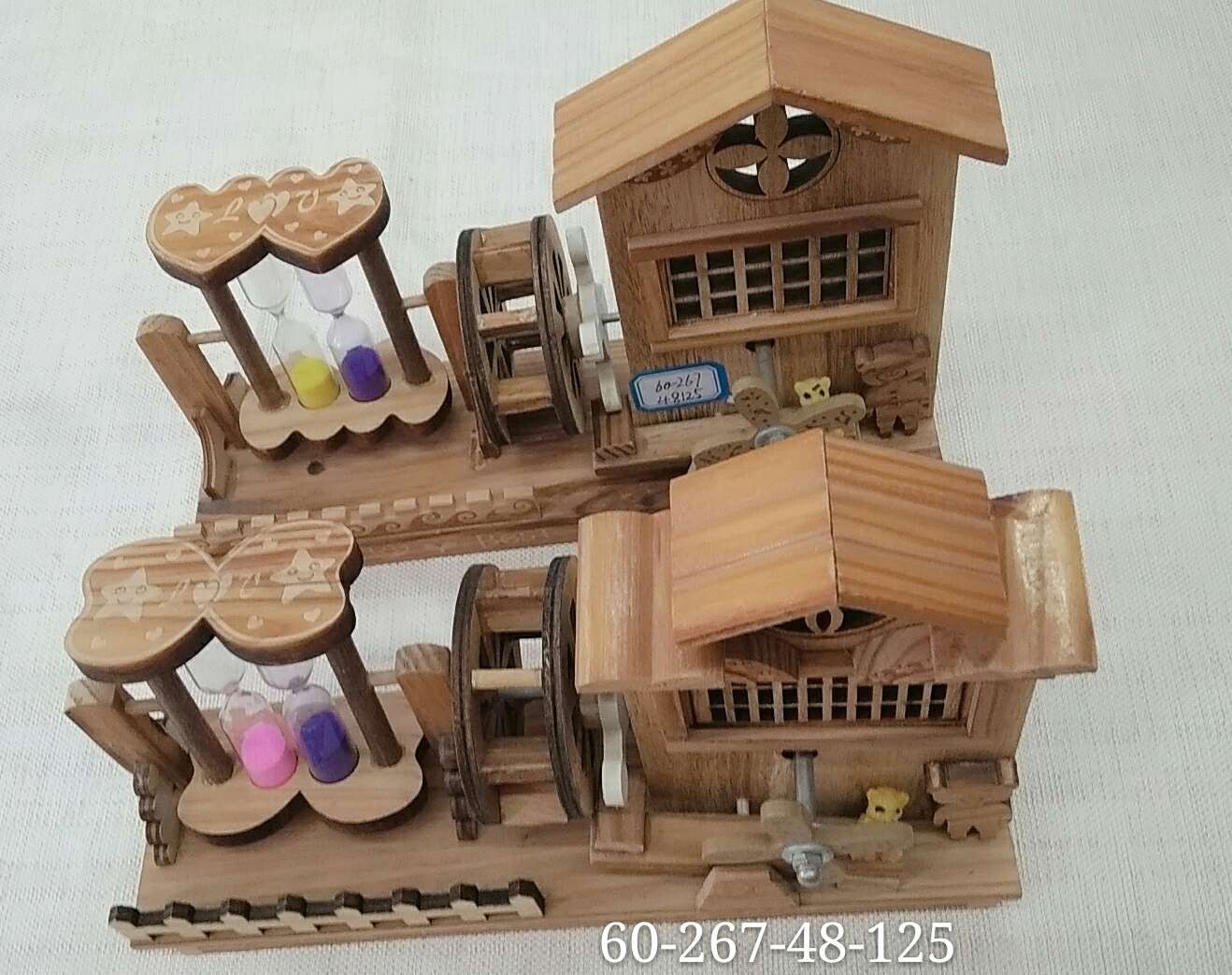 A wooden house-shaped hourglass with an hourglass eight-tone windmill