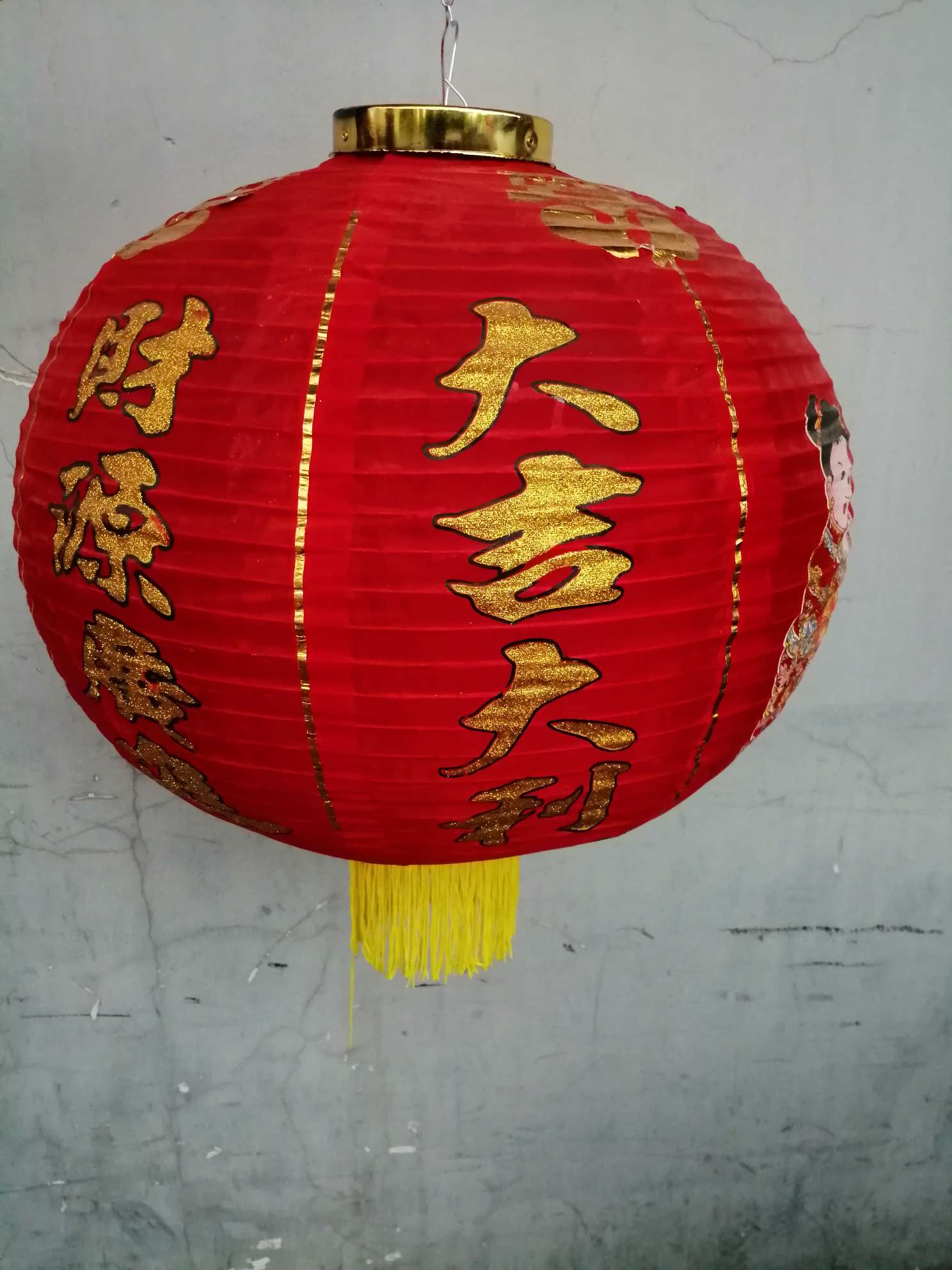 A 16-inch figure in a garden lantern