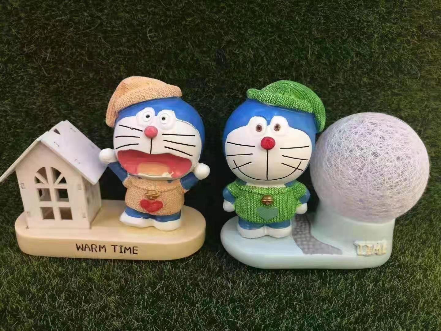 A beautiful collection set of creative gifts featuring colorful line players' figurines and Doraemon figurines