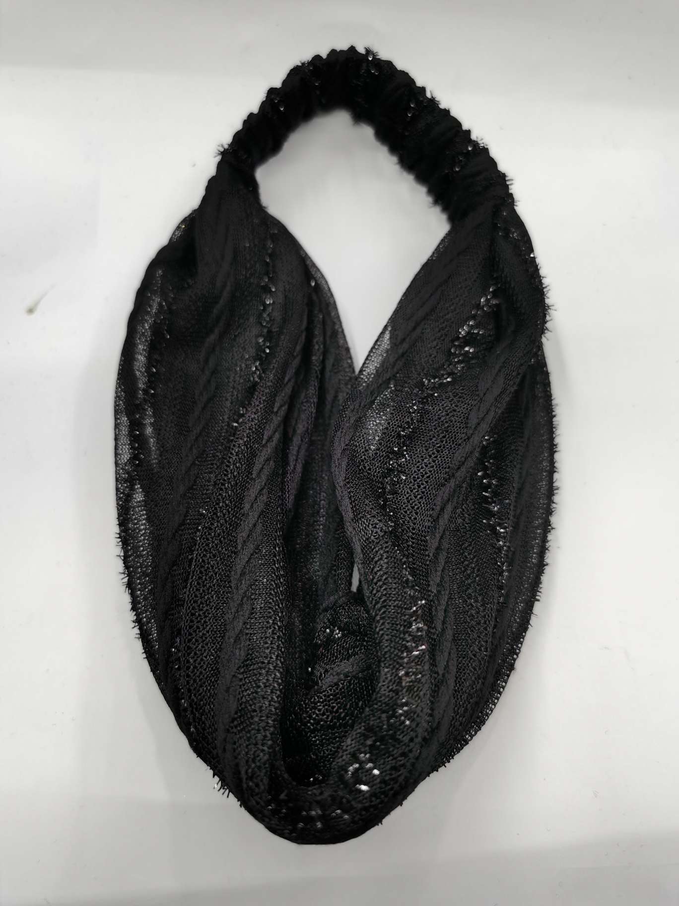 Twisted flower with wide edge covering white hair artifact black thumbnail