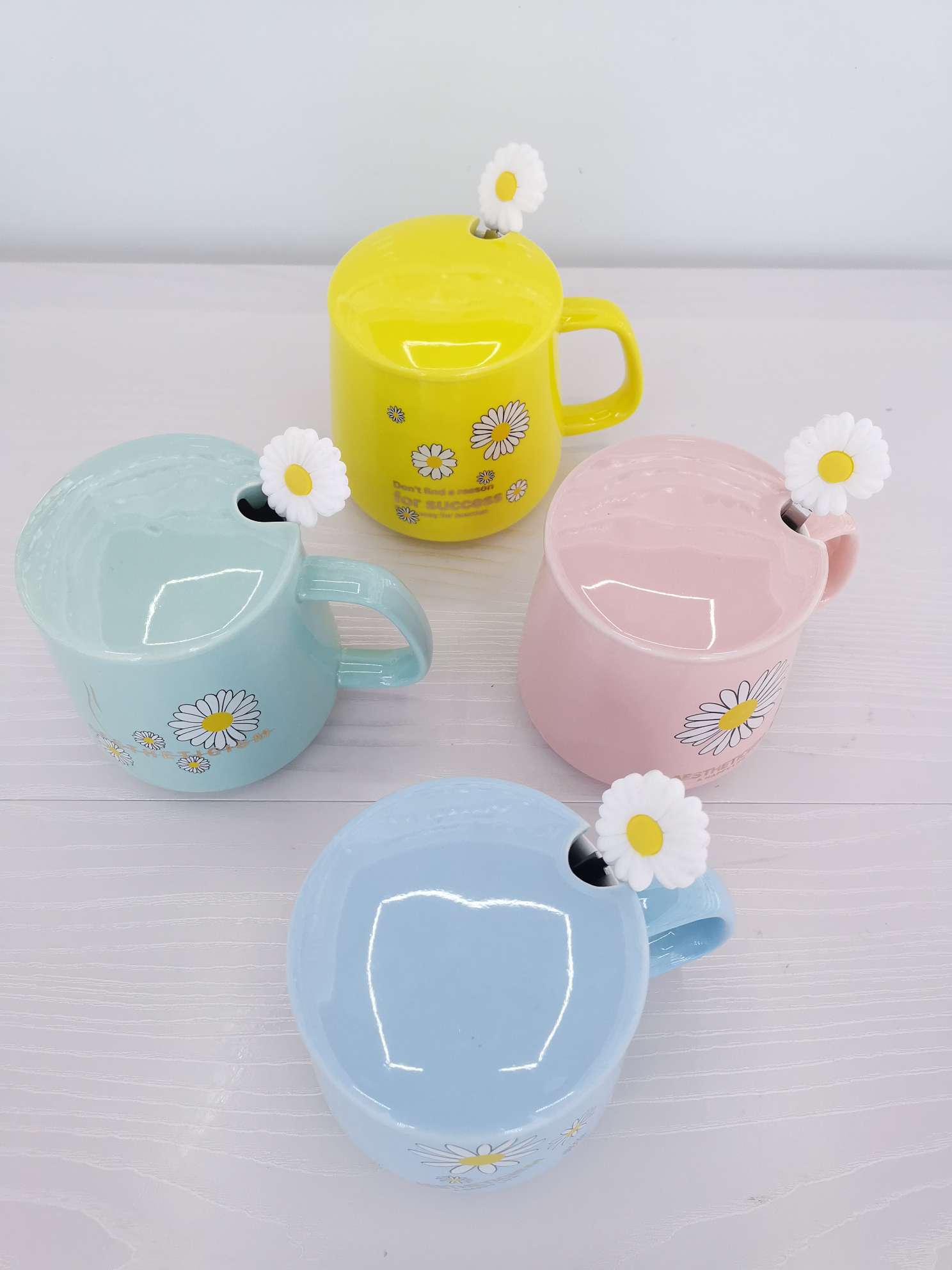 Fresh chrysanthemum-colored glazed ceramic mugs, coffee cups and water cups undefined
