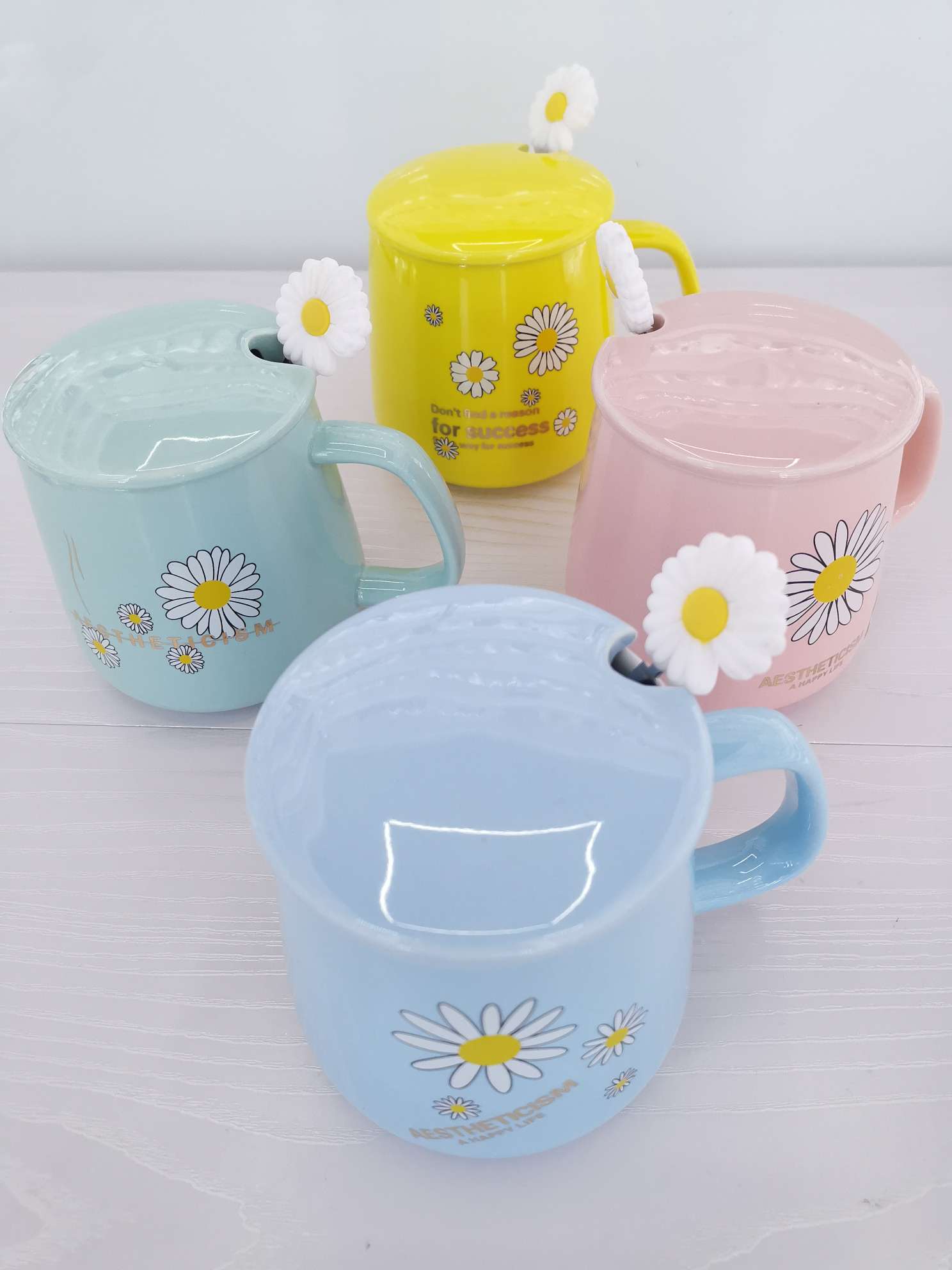 Fresh chrysanthemum-colored glazed ceramic mugs, coffee cups and water cups undefined