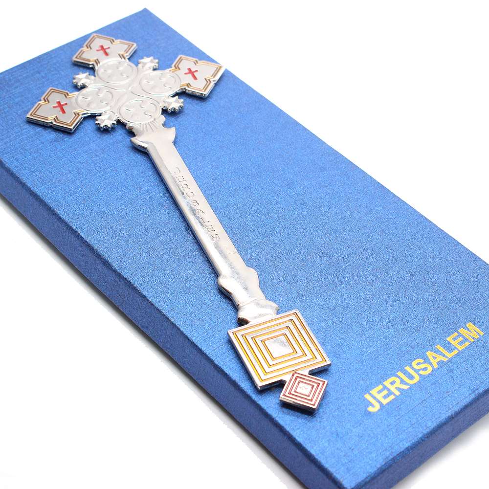 A hand-held cross made of golden white k zinc alloy as a handicraft ornament